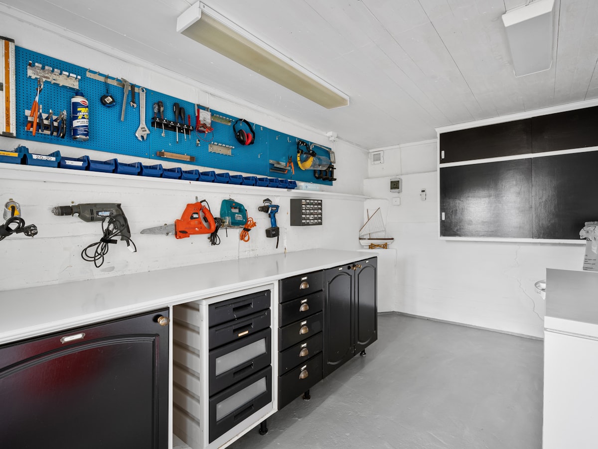 Garage wall storage representing the Pressure Washer Nozzle Holder Rail concept